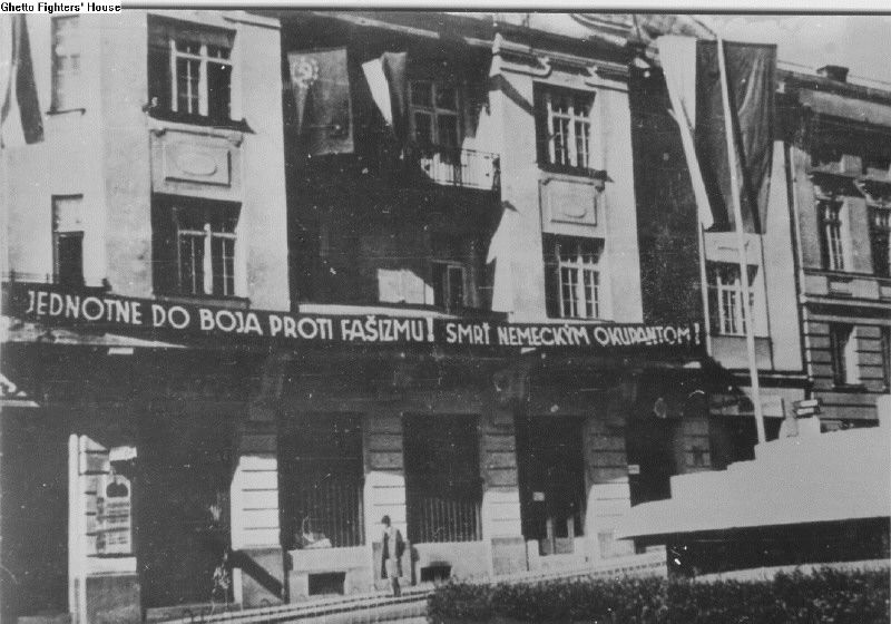 A banner displayed on the balcony of a building during the Slovak National Uprising in 1944.